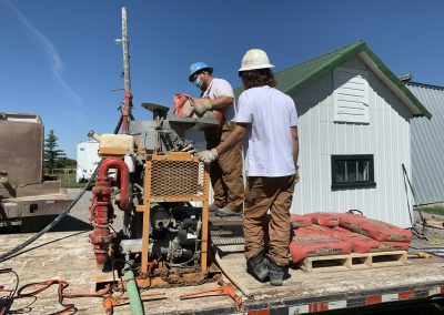 Workers Mixing Concrete